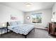 Bedroom showcasing a window with natural light and gray carpeting at 5347 Osceola St, Denver, CO 80212