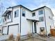 Modern two-story home with white siding and dark trim, with great curb appeal at 5347 Osceola St, Denver, CO 80212
