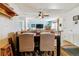 Open-concept dining area with adjacent living room and neutral colors, perfect for entertaining at 1492 S Cathay St, Aurora, CO 80017