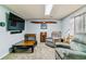 Cozy living room with comfortable seating, decor, and wall-mounted TV for entertainment at 1492 S Cathay St, Aurora, CO 80017