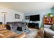 Inviting living room with blue accent wall, comfortable seating, and natural light at 1492 S Cathay St, Aurora, CO 80017