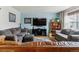 Comfortable living room with plush furniture, a large window, and modern entertainment setup at 1492 S Cathay St, Aurora, CO 80017