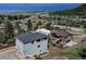 Aerial view of home overlooking a picturesque landscape with a lake and a clear view of the community at 265 Upper Glenway, Palmer Lake, CO 80133