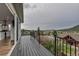The back deck features scenic views of the mountains and city and leads to the interior with a sliding glass door at 265 Upper Glenway, Palmer Lake, CO 80133