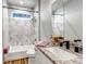 Bathroom features a granite countertop, single sink, and tiled shower at 265 Upper Glenway, Palmer Lake, CO 80133