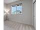 Minimalist bedroom has neutral carpet, a large window, and a closet at 265 Upper Glenway, Palmer Lake, CO 80133