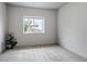 Bright bedroom features a large window, neutral carpet, and light gray walls at 265 Upper Glenway, Palmer Lake, CO 80133