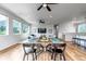 Open-concept living and dining area with scenic views and stylish modern furnishings at 265 Upper Glenway, Palmer Lake, CO 80133