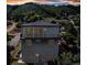 Striking home with large windows, a balcony, and a modern design offering fantastic views and outdoor living spaces at 265 Upper Glenway, Palmer Lake, CO 80133