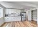 Well-lit kitchen features stainless steel appliances and white cabinetry at 265 Upper Glenway, Palmer Lake, CO 80133