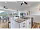 Kitchen island boasts granite countertop, bar seating, and scenic mountain views at 265 Upper Glenway, Palmer Lake, CO 80133