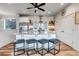 Beautiful kitchen island with granite countertops, stainless steel appliances, and ample seating at 265 Upper Glenway, Palmer Lake, CO 80133