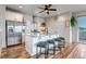 Modern kitchen with granite countertops, stainless steel appliances, and a central island with bar stools at 265 Upper Glenway, Palmer Lake, CO 80133