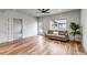 Inviting living room boasts wood floors, a cozy sofa, and a view to the backyard at 265 Upper Glenway, Palmer Lake, CO 80133