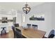 A dining room featuring wood floors, a table and chairs, and mountain view art at 10546 Graymont Ln # D, Highlands Ranch, CO 80126