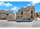 Exterior of a townhome showcasing the facade with garages, second-floor balcony, and well-maintained landscaping at 10546 Graymont Ln # D, Highlands Ranch, CO 80126