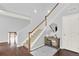 Inviting foyer with a staircase, hardwood floors, and a console table with decorative accents at 10546 Graymont Ln # D, Highlands Ranch, CO 80126
