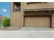 Attached garage door with driveway on a sunny day at 10546 Graymont Ln # D, Highlands Ranch, CO 80126