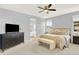 Comfortable main bedroom featuring a view to the ensuite bathroom and a dark dresser at 10546 Graymont Ln # D, Highlands Ranch, CO 80126