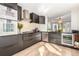 Stylish kitchen featuring dark cabinets, stainless steel appliances, and lots of natural light at 1980 Joslyn Pl, Boulder, CO 80304