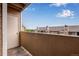 Private balcony view of a well-maintained residential complex under a bright sky at 2929 W Floyd Ave # 217, Denver, CO 80236