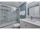 Modern bathroom with marble-tiled shower, sleek glass doors, and updated vanity for a luxurious feel at 2929 W Floyd Ave # 217, Denver, CO 80236