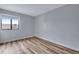 Bedroom with wood floors, a window, and neutral wall color creating a bright and inviting space at 2929 W Floyd Ave # 217, Denver, CO 80236