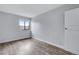 Bedroom with wood floors, a window, and a closet door, creating a bright and inviting space at 2929 W Floyd Ave # 217, Denver, CO 80236