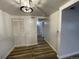 The hallway features wood floors and access to multiple rooms at 2929 W Floyd Ave # 217, Denver, CO 80236