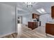Spacious open-concept kitchen featuring sleek appliances, wood cabinets, and ample countertop space at 2929 W Floyd Ave # 217, Denver, CO 80236