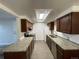 Well-lit kitchen with granite countertops, tile floors and stainless steel appliances at 2929 W Floyd Ave # 217, Denver, CO 80236