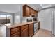 The kitchen features stainless steel appliances, granite countertops and wood cabinets at 2929 W Floyd Ave # 217, Denver, CO 80236