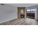Bright living room featuring a stone fireplace and sliding glass doors to outdoor living space at 2929 W Floyd Ave # 217, Denver, CO 80236