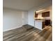 This living room provides access to the kitchen at 2929 W Floyd Ave # 217, Denver, CO 80236