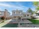 Backyard view showing a covered patio and a landscaped yard at 4249 S Biscay Cir, Aurora, CO 80013
