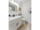 Stylish bathroom featuring modern vanity with sleek fixtures and decorative tile accents at 4249 S Biscay Cir, Aurora, CO 80013