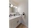 Bathroom features a modern vanity with stylish fixtures, a clean white counter, and a sleek mirror at 4249 S Biscay Cir, Aurora, CO 80013