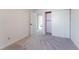 Comfortable bedroom features neutral carpeting, a closet with sliding doors, and a bright doorway at 4249 S Biscay Cir, Aurora, CO 80013