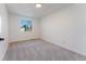 Well-lit bedroom includes neutral carpet, a window offering natural light, and freshly painted walls at 4249 S Biscay Cir, Aurora, CO 80013