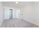 Clean bedroom offers neutral carpeting, a closet with sliding doors, and an entrance to the hallway at 4249 S Biscay Cir, Aurora, CO 80013