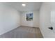 Neutral bedroom with a window offering natural light and plush carpeting at 4249 S Biscay Cir, Aurora, CO 80013