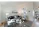 Bright living room with modern decor, natural light, and open view to the kitchen at 4249 S Biscay Cir, Aurora, CO 80013