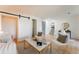 Bright living room with a modern design, stylish furniture, and access to other rooms at 4249 S Biscay Cir, Aurora, CO 80013