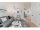 Bright living room with modern decor, natural light, and open view to the dining room at 4249 S Biscay Cir, Aurora, CO 80013
