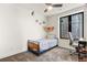 Bright bedroom with a cozy bed, modern ceiling fan, and a window with a view at 581 Fairview Blvd, Breckenridge, CO 80424