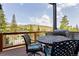 Outdoor deck featuring a dining set, grill, and mountain views at 581 Fairview Blvd, Breckenridge, CO 80424