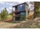 Stunning multi-story home featuring a modern design with multiple balconies and outdoor living spaces at 581 Fairview Blvd, Breckenridge, CO 80424