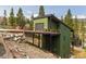Unique home design with a bridge entrance, garage and mountain views at 581 Fairview Blvd, Breckenridge, CO 80424