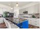 Modern kitchen with a large island, sleek countertops, and contemporary lighting fixtures at 581 Fairview Blvd, Breckenridge, CO 80424