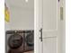 Contemporary laundry room with sleek washer and dryer, featuring a stylish sliding door at 581 Fairview Blvd, Breckenridge, CO 80424
